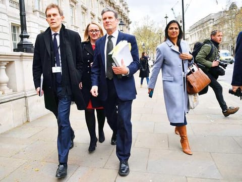 Labour’s new leader Keir Starmer (centre) leaves the Cabinet Office in London 