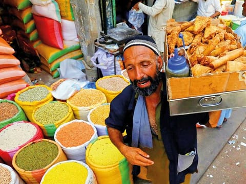 A vendor in Karachi. Pakistan has made considerable progress in the last few months in advancing reforms and continuing with sound economic policies, the IMF said.