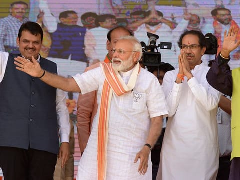 Prime Minister Narendra Modi, Shiv Sena chief Uddhav Thackeray and Maharashtra CM Devendra Fadanvis (L) at an election campaign rally in support of alliance candidates at Ausa in Latur district, Maharashtra, Tuesday, April 9, 2019. 