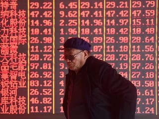 Stock information at a brokerage firm in Hangzhou, China. 