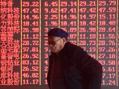 Stock information at a brokerage firm in Hangzhou, China. 