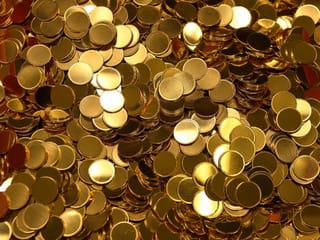 Gold prices inch lower as strong equities weigh