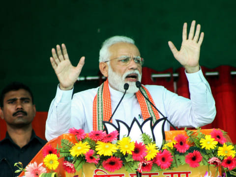 Indian Prime Minister Narendra Modi gestures while speaking at an election rally during the first phase of the Indian general elections in Bhagalpur, in the Indian state of Bihar on April 11, 2019. 