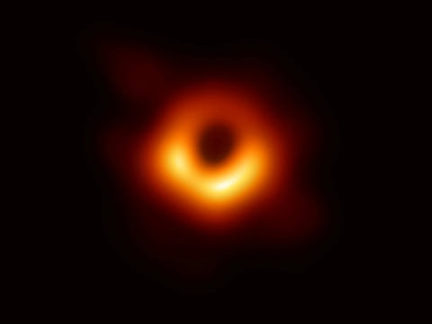 The first ever photo of a black hole, taken using a global network of telescopes, conducted by the Event Horizon Telescope (EHT) project, to gain insight into celestial objects with gravitational fields so strong that no matter or light can escape, is shown in this handout released April 10, 2019.