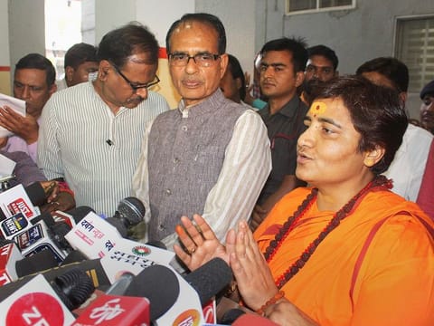 BJP candidate for Bhopal Lok Sabha seat Sadhvi Pragya Singh Thakur, with BJP vice president Shivraj Singh Chouhan, addresses a press conference at the party's state headquarters in Bhopal, on Wednesday.  