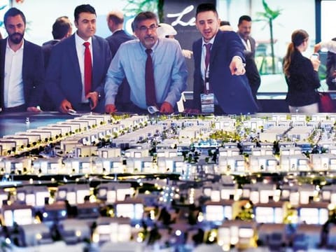 Visitors at the Aldar pavilion during the recently concluded Cityscape Abu Dhabi exhibition. Under the legislative changes, land and residential units in designated investment zones can be registered under Abu Dhabi’s freehold law.