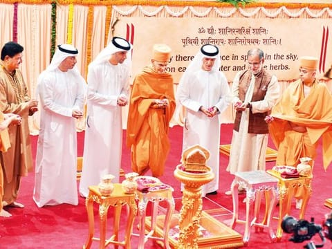 Mahant Swami Maharaj and other priests perform rituals in the presence of Thani Bin Ahmad Al Zeyoudi, Ahmad Bel Houl Al Falasi, Dr Mugheer Khamis Al Khaili, Navdeep Suri and Dr B.R. Shetty during the foundation stone-laying ceremoney for the temple in Abu Dhabi on Saturday.