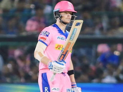 Rajasthan Royals' Steve Smith raises his bat after scoring fifty during the IPL match against Mumbai Indians in Jaipur, on Saturday. 