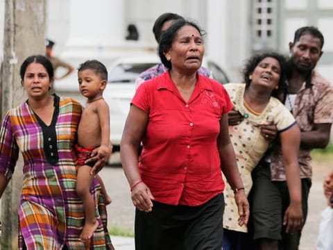 Relatives of a blast victim grieve outside a morgue in Colombo, Sri Lanka, on Sunday. 