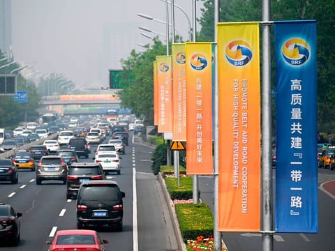 Banners are displayed along a street ahead of the Belt and Road Forum in Beijing on April 22, 2019.