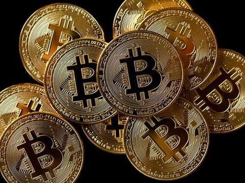 A collection of Bitcoin (virtual currency) tokens are displayed in this picture illustration.