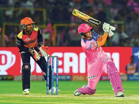 Rajasthan Royals batsman Liam Livingstone (R) plays a shot as Sunrisers Hyderabad wicket keeper Wriddhiman Saha (L) looks on during the 2019 Indian Premier League (IPL) Twenty20 cricket match between Rajasthan Royals and Sunrisers Hyderabad at the Sawai Mansingh Stadium in Jaipur on April 27, 2019.