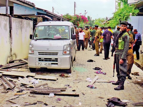 Sri Lankan police and army soldiers secure the site after an explosion and a gunbattle in Kalmunai, in eastern Sri Lanka Saturday, April 27, 2019. 
