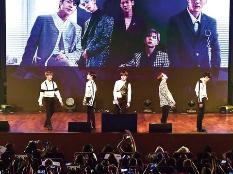 IMFACT performing live.