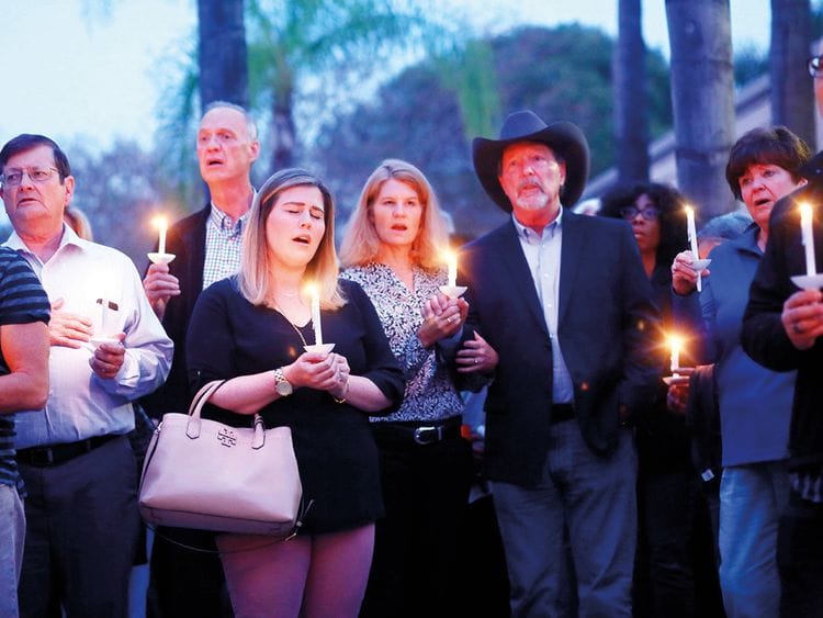 Mourners, including Poway Mayor Steve Vaus