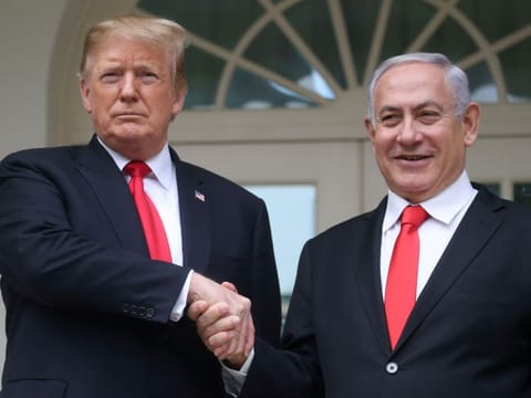 File photo: US President Donald Trump shakes hands with Israel's Prime Minister Benjamin Netanyahu as they pose on the West Wing colonnade in the Rose Garden at the White House in Washington, on March 25, 2019