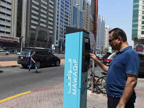 A resident takes the parking ticket at Mawaqif Parking area near Hamdan street in Abu Dhabi. Parking will be 