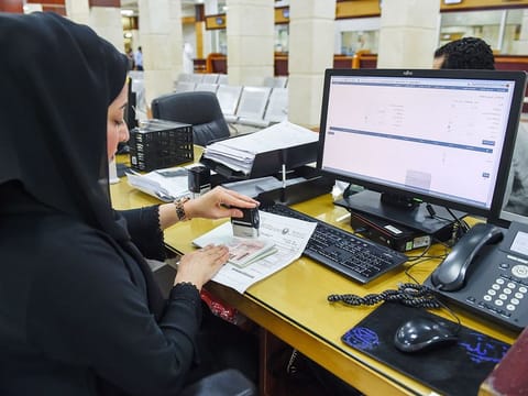 An employee at work at the General Directorate of Residency and Foreign Affairs (GDRFA) in Dubai.  