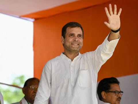 Congress President Rahul Gandhi waves at supporters during an election campaign for Lok Sabha polls, in Barabanki.
