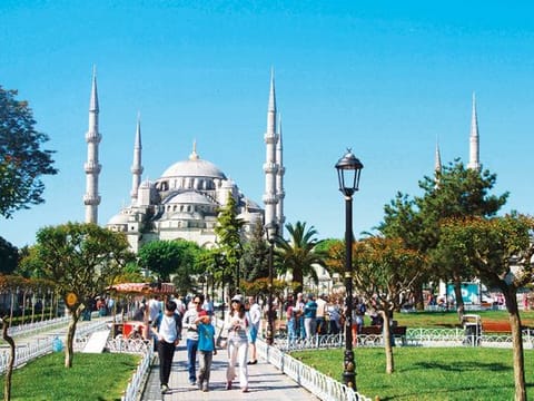 Tourists at the Blue Mosque in Istanbul. The drop in the relative value of the lira, which started in 2018, has benefited the country’s tourism sector.