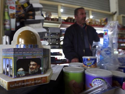 A piggy bank with a photo of Hezbollah leader Hassan Nasrallah at a shop in the southern Lebanese village of Kfar Rumman.