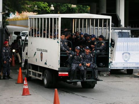 National Police enter the Helicoide prison in Caracas, Venezuela, Thursday, May 9, 2019, where Edgar Zambrano, vice president of the opposition-controlled National Assembly is being held after his arrest the previous night. 