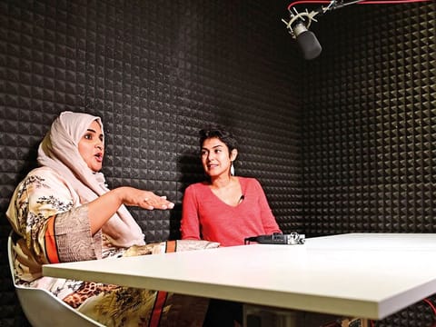 Rana Nawas (right), the producer of the English-language series 'When Women Win', hosts Saudi Arabian comedian Hatoon Kadi during a podcast recording session in Dubai on April 25, 2019. 