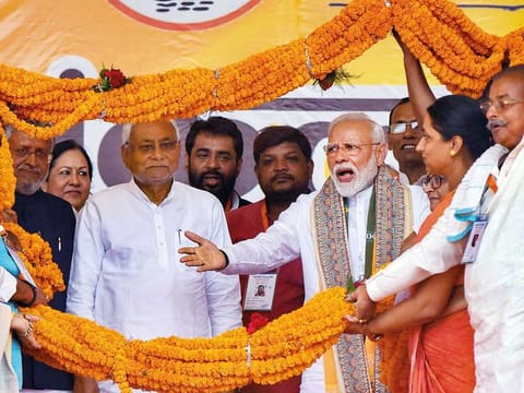 Prime Minister Modi and Bihar Chief Minister Nitish Kumar being garlanded during an election rally at Paliganj in Patna on Wednesday.