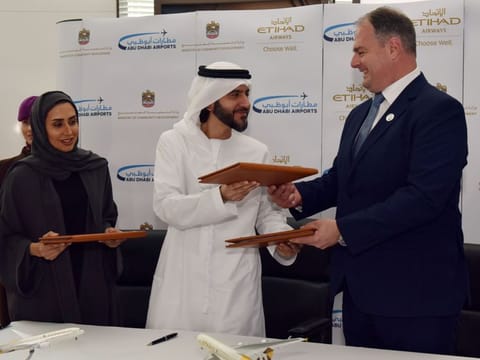 The memorandum of understanding was signed by Hessa Tahlak, Assistant Undersecretary of Social Development(1st left) Mohammad Al Bulooki, Chief Operating Officer, Etihad Aviation Group(centre) and Brayan Thompson, CEO Abu Dhabi Airports at the Etihad Airways Innovation Centre in Abu Dhabi. 