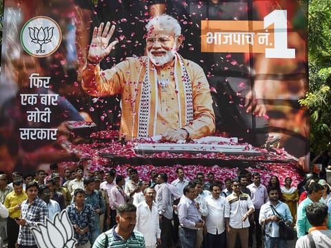 BJP supporters gather to celebrate on the election results outside the party headquarters in Mumbai. 