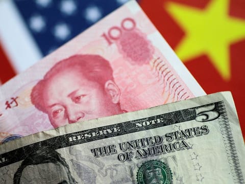 US Dollar and China Yuan notes. For illustrative purposes only.
