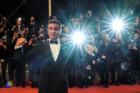 US actor Sylvester Stallone poses as he arrives for the screening of "Homage to Sylvester Stallone - Rambo : First Blood" at the 72nd edition of the Cannes Film Festival in Cannes, southern France, on May 24, 2019. 