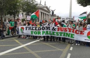 People come together to support Palestine as they walk towards the Israeli embassy in Dublin, Ireland 