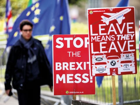 Brexit posters are seen in Westminster in London.