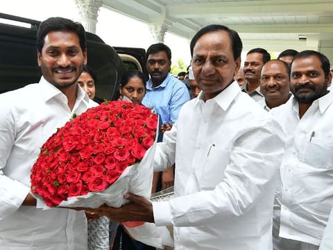 Indian YSR Congress Party president and newly elected Chief Minister of Andhra Pradesh YS Jagan Mohan Reddy (L) is welcomed by Telangana Chief Minister K Chandrasekhar Rao (2L) in Hyderabad on May 25, 2019.