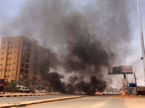 Burning tires set by protesters produce black smoke on road 60, near Khartoum's army headquarters, in Khartoum, Sudan, Monday, June 3, 2019.