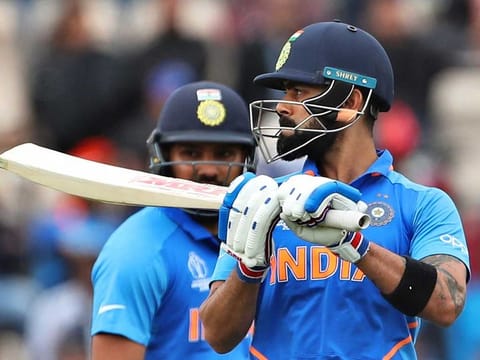 India's Rohit Sharma, left, watches captain Virat Kohli react after being dismissed during the Cricket World Cup match between South Africa and India at the Hampshire Bowl in Southampton, England, Wednesday, June 5, 2019. 
