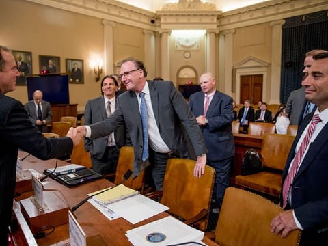 Chairman Rep. Adam Schiff, D-Calif., left, greets State Department Bureau of Intelligence and Research Office of Geography and Global Affairs Senior Analyst Dr Rod Schoonover, second from right, Office of the Director of National Intelligence National Intelligence Council counselor Peter Kiemel, center, and Senior Naval Intelligence Manager for Russia and Eurasia Jeff Ringhausen, right, appear before a House Intelligence Committee hearing on national security implications of climate change on Capitol Hill in Washington, Wednesday, June 5, 2019. 