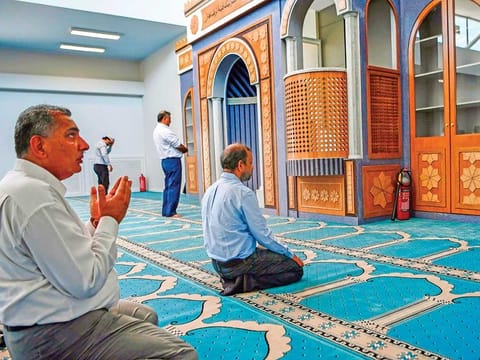 Muslim faithfuls pray in a mosque in Athens, the first official place of worship for Athens Muslims in over a century.
