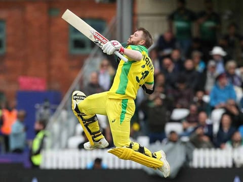 Australia's David Warner celebrates his century during the Cricket World Cup group stage match against Pakistan at the County Ground Taunton, England, Wednesday June 12, 2019. 