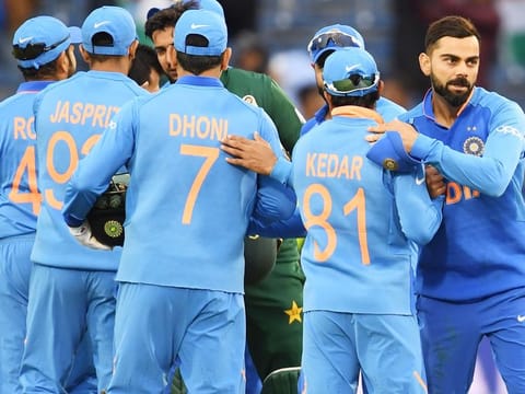India's captain Virat Kohli (R) celebrates with teammates after their victory. 
