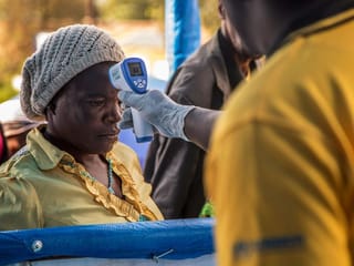 A Congolese refugee is screened for Ebola symptoms at the IRC triage facility in the Kyaka II refugee settlement in Kyegegwa District in western Uganda.
