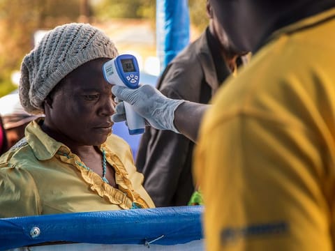 A Congolese refugee is screened for Ebola symptoms at the IRC triage facility in the Kyaka II refugee settlement in Kyegegwa District in western Uganda.