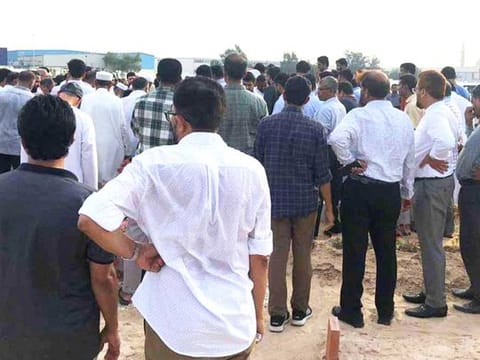Relatives and friends attend the funeral for Mohammad Farhan. The Indian family were scheduled to fly home later this month for the wedding of their eldest daughter.