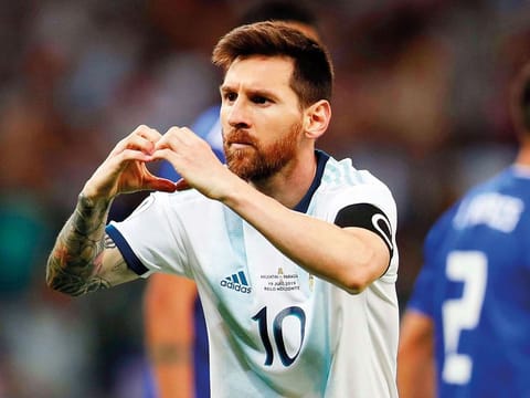 Argentina's Lionel Messi celebrates after scoring from a penalty spot against Paraguay during a Copa America Group B soccer match at Mineirao stadium in Belo Horizonte, Brazil, onWednesday. 