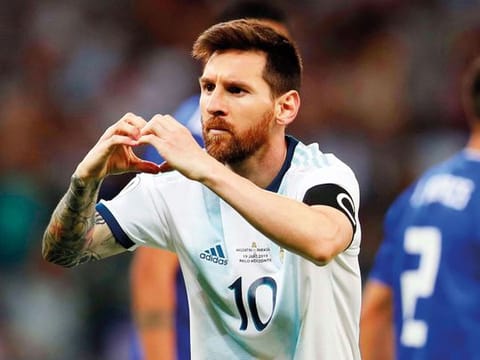 Argentina's Lionel Messi celebrates after scoring from a penalty spot against Paraguay during a Copa America Group B soccer match at Mineirao stadium in Belo Horizonte, Brazil, onWednesday. 