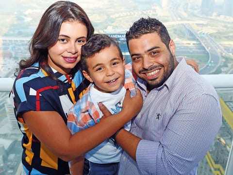 Aya Baker, her husband Tarek Ahmad Fouad Syed and son Yousuf at their home in Dubai. Tarek and Aya are grateful that their first son Yousuf is unaffected by their genetic condition.