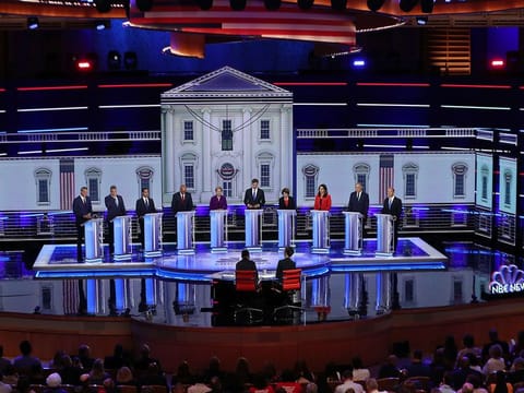 Democratic presidential candidates New York City Mayor Bill De Blasio (L-R), Rep. Tim Ryan (D-OH), former housing secretary Julian Castro, Sen. Cory Booker (D-NJ), Sen. Elizabeth Warren (D-MA), former Texas congressman Beto O’Rourke, Sen. Amy Klobuchar (D-MN), Rep. Tulsi Gabbard (D-HI), Washington Gov. Jay Inslee, and former Maryland congressman John Delaney take part in the first night of the Democratic presidential debate on June 26, 2019 in Miami, Florida.