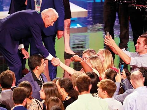 Democratic presidential candidate former vice president Joe Biden greets supporter after the Democratic primary debate hosted by NBC News at the Adrienne Arsht Center for the Performing Art in Miami.