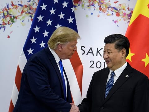 China's President Xi Jinping (R) greets US President Donald Trump before a bilateral meeting on the sidelines of the G20 Summit in Osaka on June 29, 2019.
